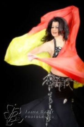 Anoush dancing with a colorful veil