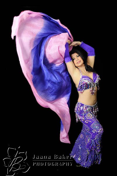 Anoush dancing with a purple veil